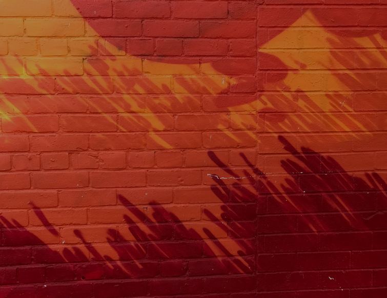 a red and orange painted brick wall