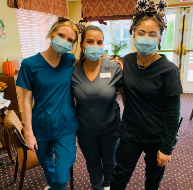 a group of women wearing face masks