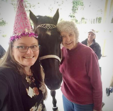 a person taking a selfie with a horse