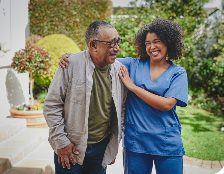 a person in blue scrubs smiling at a person