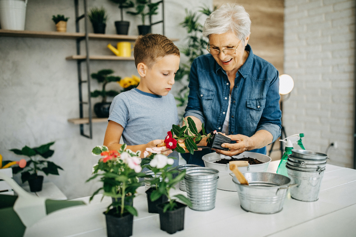 a person and child planting flowers