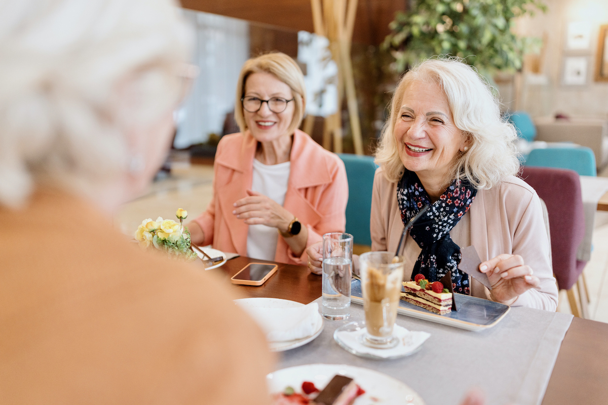 a group of women sitting at a table