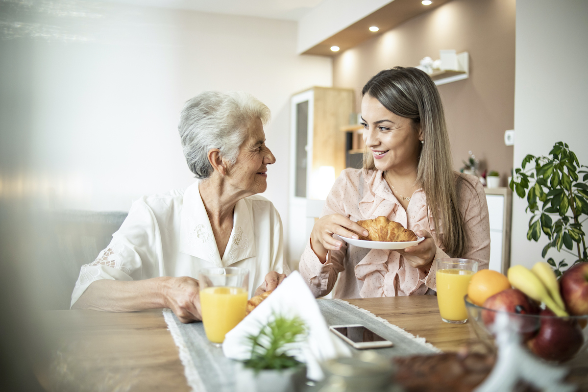 a person and a person sitting at a table