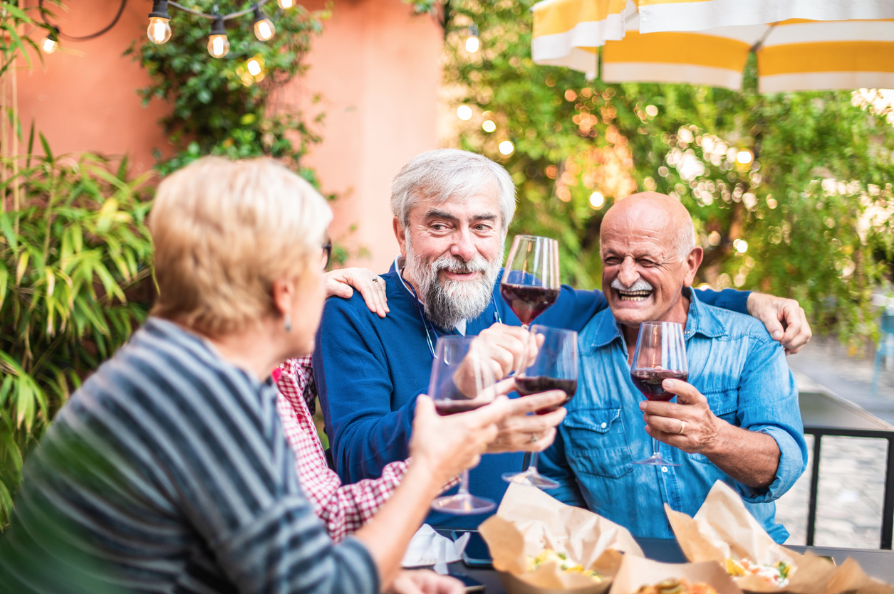 a group of people holding wine glasses