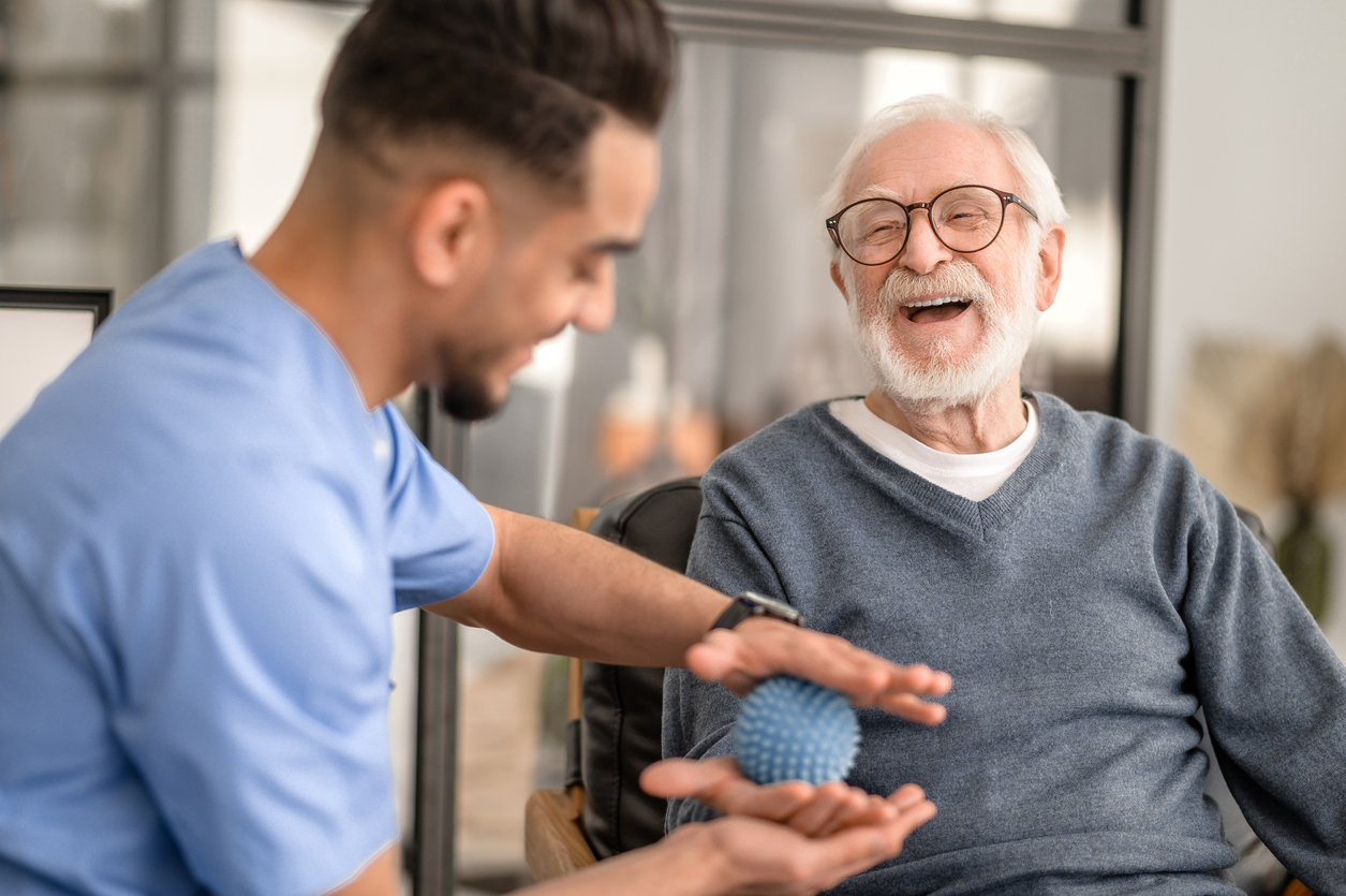 a person holding a ball in his hand