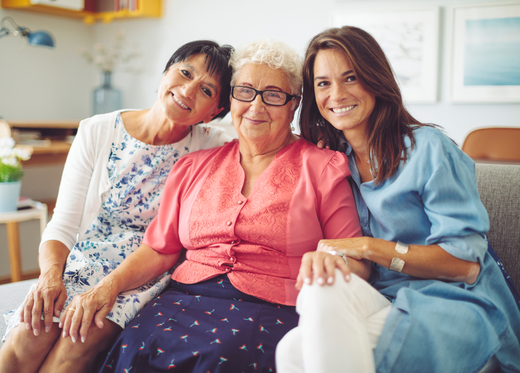 a group of women sitting together smiling