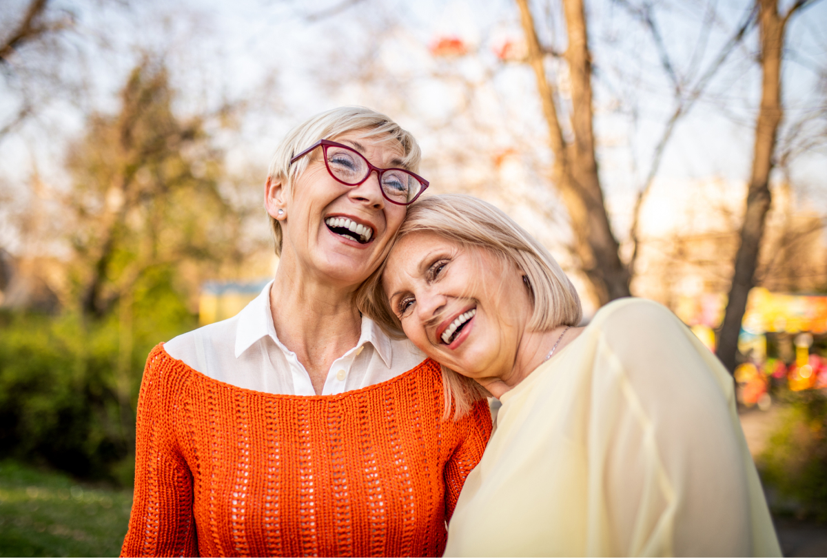 two women smiling at the camera