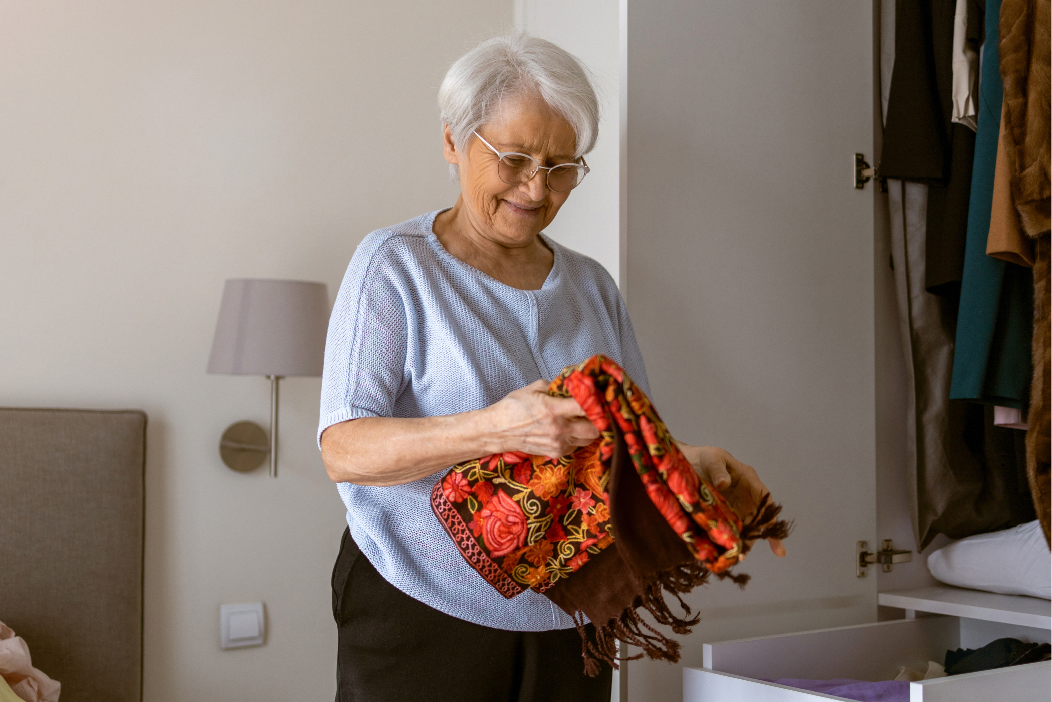 a person holding a scarf
